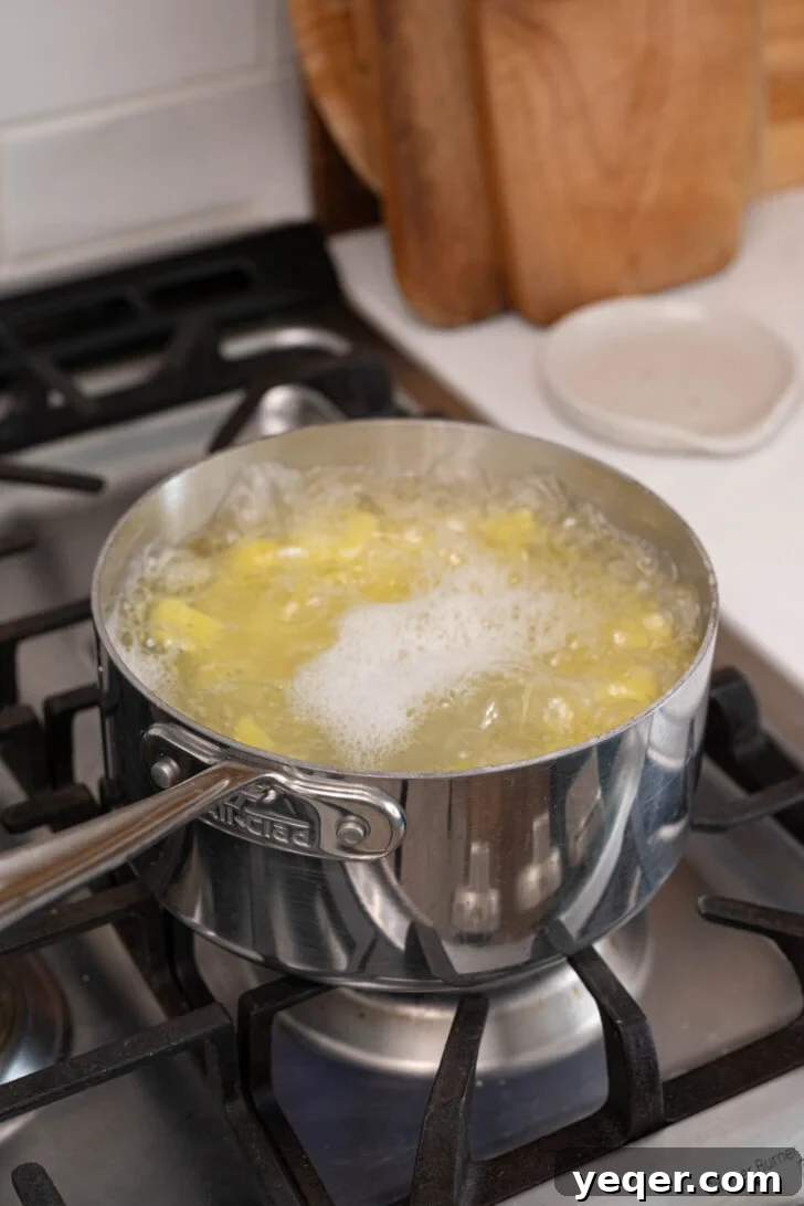 Savory Chorizo, Potato, and Egg Skillet 5 Cubed potatoes soaking in a bowl of cold water.