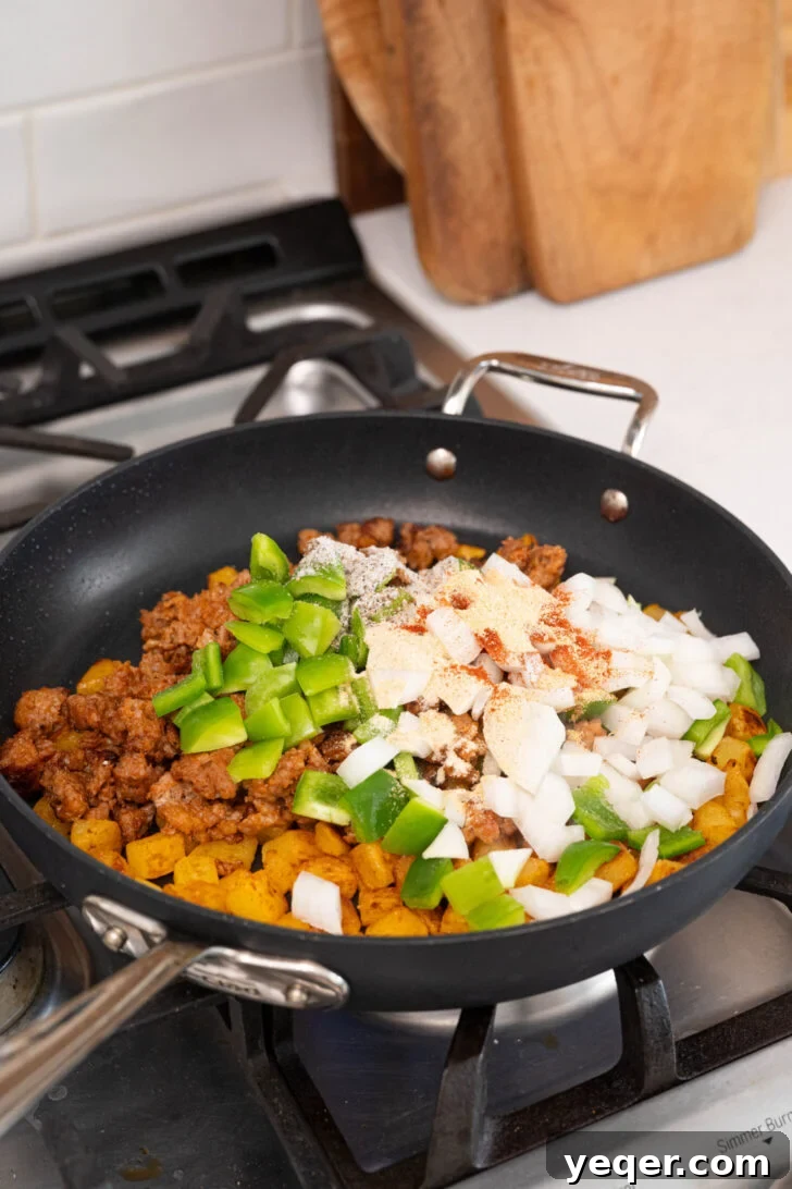 Savory Chorizo, Potato, and Egg Skillet 7 Golden-brown potatoes, cooked chorizo, diced peppers, and onions in a large skillet.