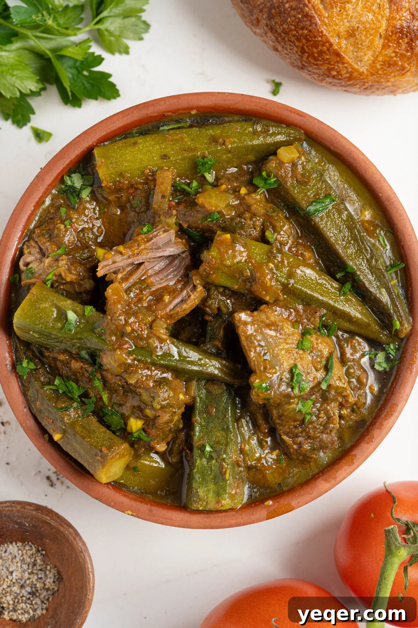 Moroccan Tagine with Okra and Tomatoes 2 A vibrant bowl of Moroccan okra stew, showcasing tender beef and fresh okra in a rich tomato sauce.