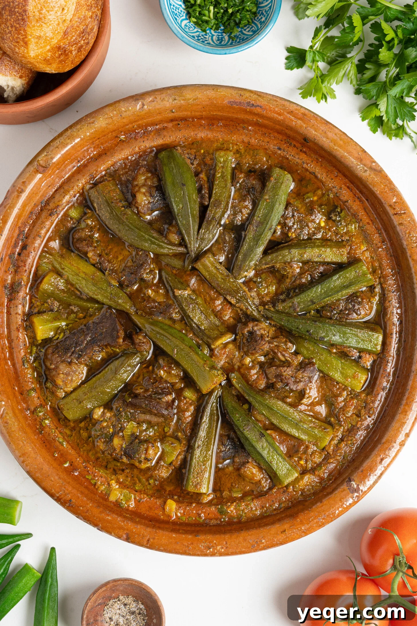 Moroccan Tagine with Okra and Tomatoes 10 A full tagine pot brimming with Moroccan okra stew, artfully arranged and ready for serving.