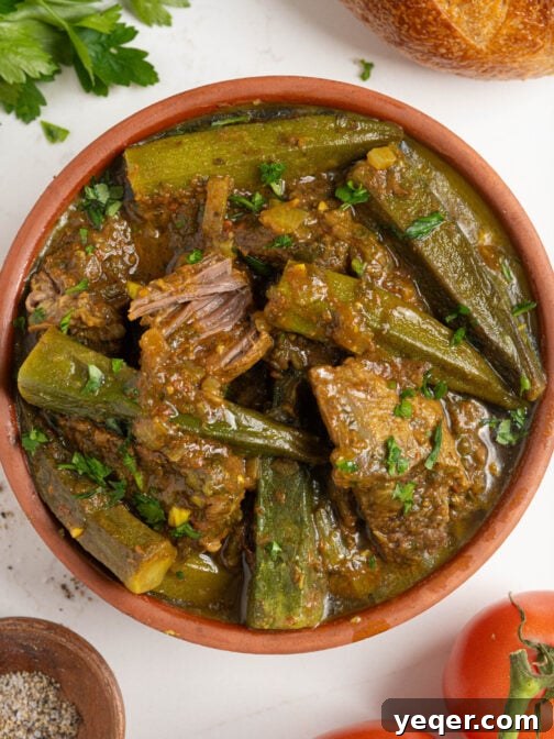 A bowl of Moroccan okra stew, rich with beef and tomato, ready to be served.