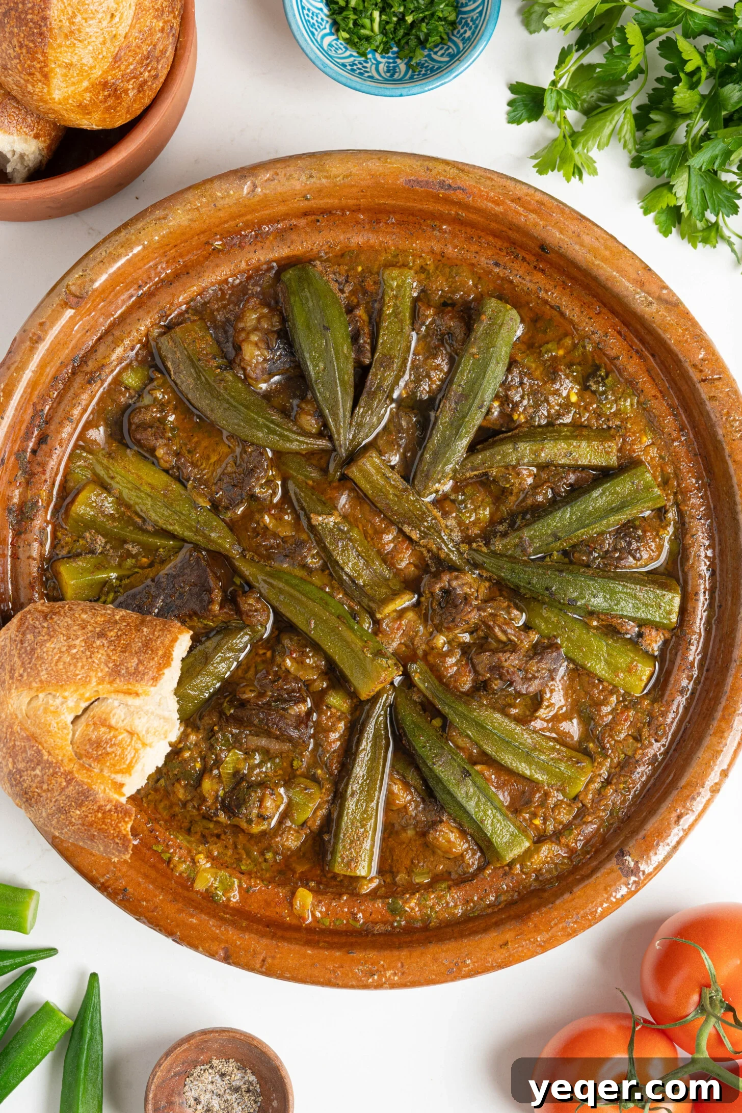 Moroccan Tagine with Okra and Tomatoes 8 A beautifully presented tagine of Moroccan okra stew, steaming and ready to serve.