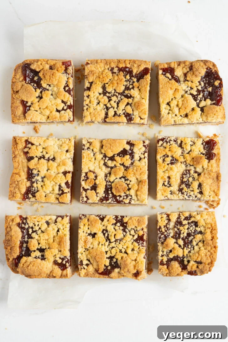 Golden Guava Crumble Bars 7 Freshly baked guava bars, cooled and perfectly sliced on a counter.