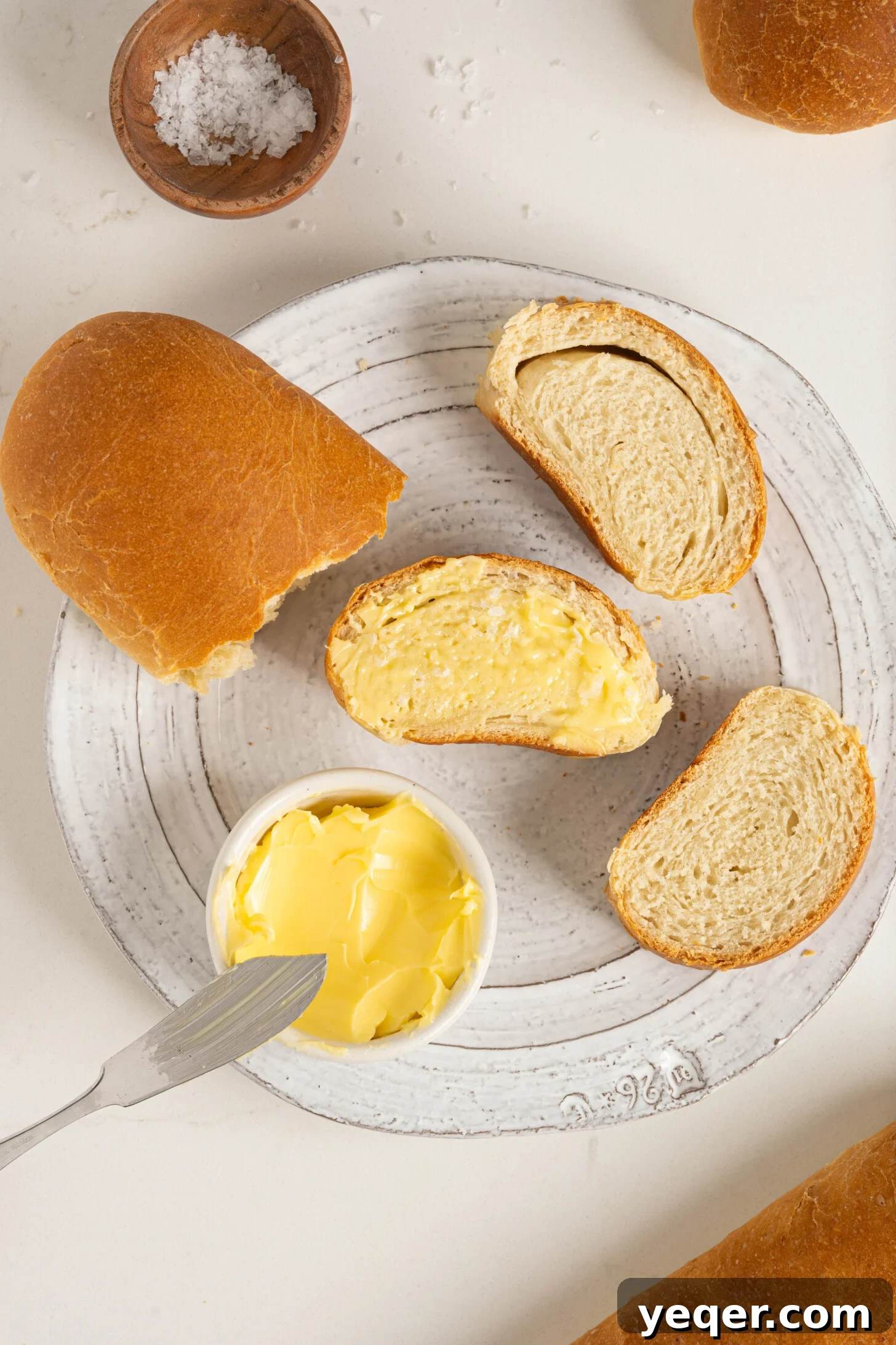 Pan Sobao Puerto Rican Soft Sweet Bread 2 A plate with sliced pan sobao, showing its soft, fluffy texture.