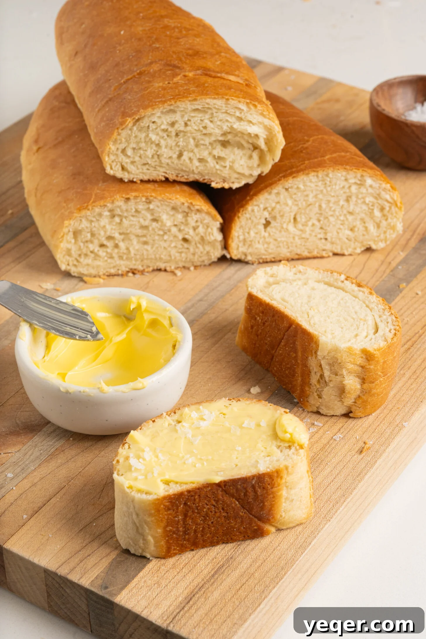 Pan Sobao Puerto Rican Soft Sweet Bread 10 A cutting board with perfectly sliced pan sobao, revealing its soft interior.