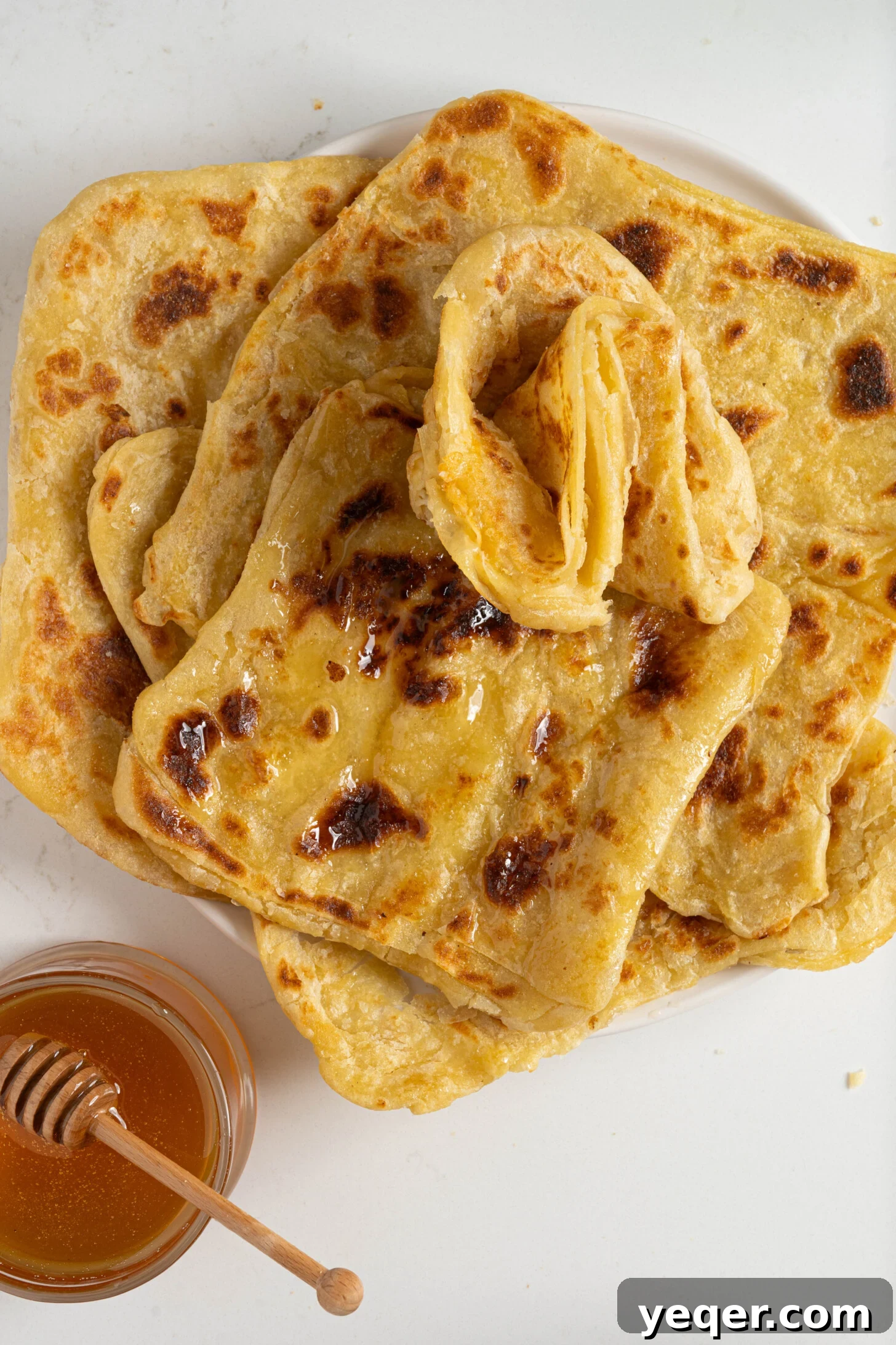Msmen: Morocco's Iconic Flaky Flatbread 5 A beautifully arranged plate of Msmen, ready to be served.