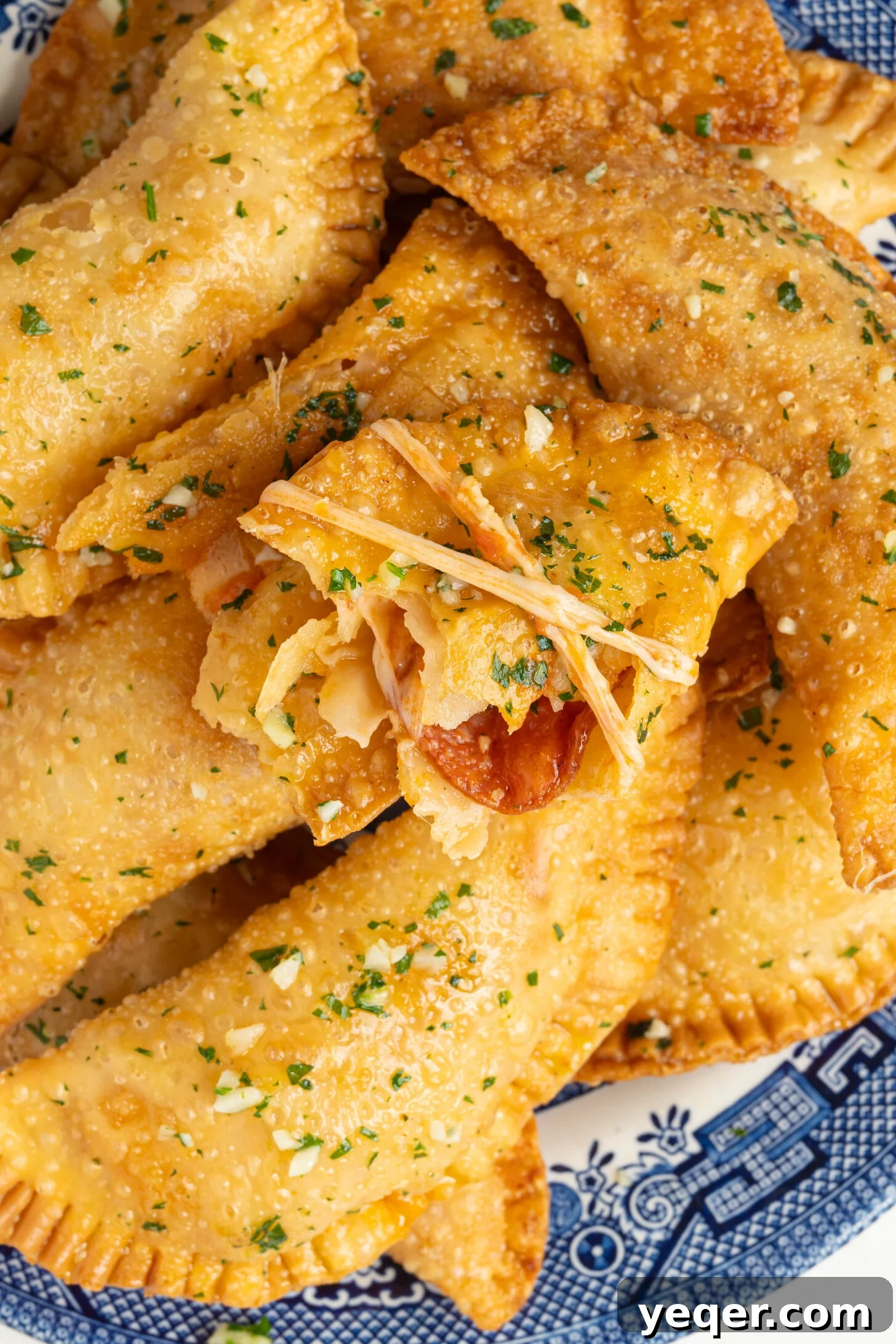 Quick Pizza Pockets 2 Freshly fried Pizza Empanadas on a plate, ready to be served.