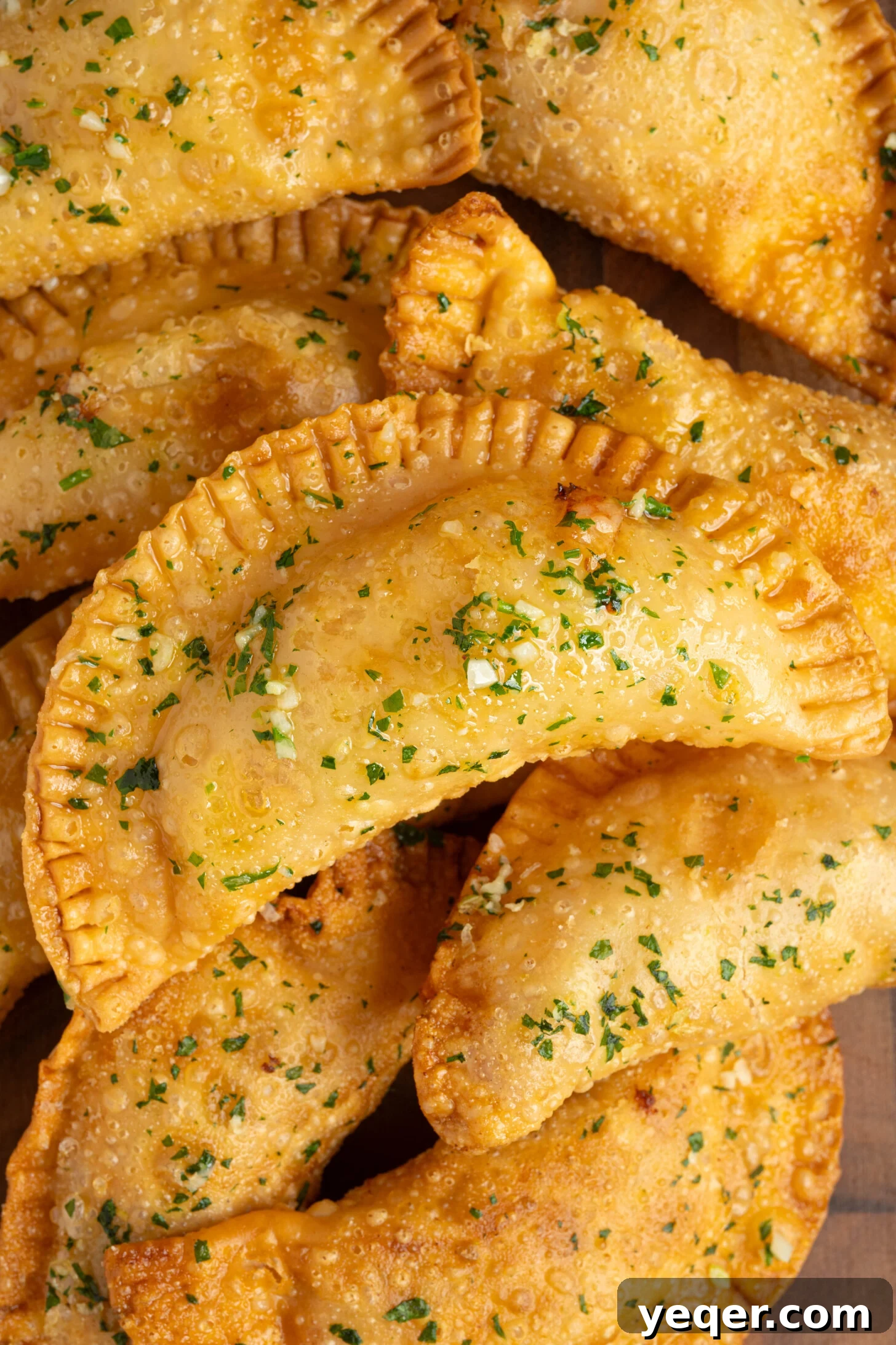 Quick Pizza Pockets 3 Platter of golden brown Pizza Empanadas with dipping sauce.