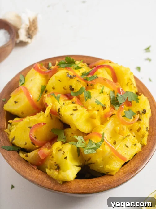 A bowl of Steamed Yuca with Garlic (Yuca con Mojo), a classic Caribbean side dish.