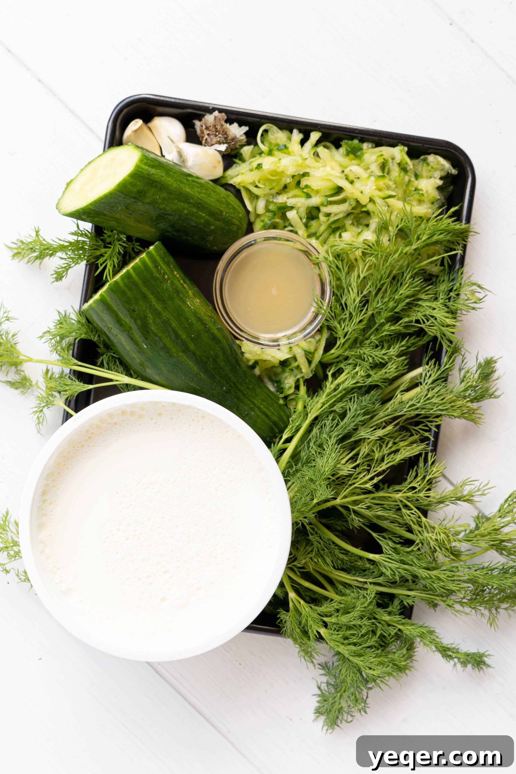Refreshing Dill Tzatziki 3 All the fresh ingredients needed to make homemade tzatziki sauce, neatly arranged.