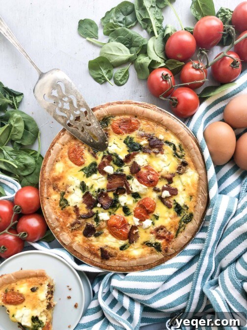 Delicious Mother's Day Quiche with bacon, tomatoes, spinach and goat cheese.