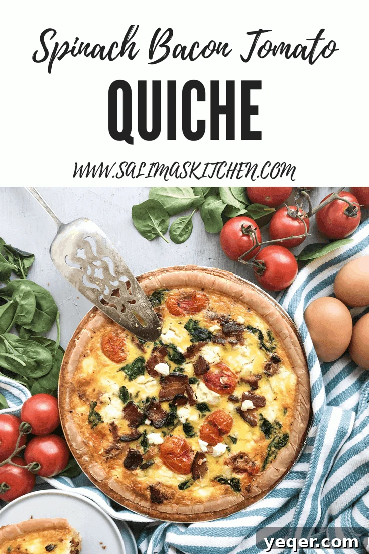 Mother's Day Brunch Dream Quiche 7 A stunning visual of the Mother's Day Quiche, generously filled with bacon, spinach, tomatoes, and goat cheese, placed enticingly next to a patterned tea towel, perfect for pinning on Pinterest.