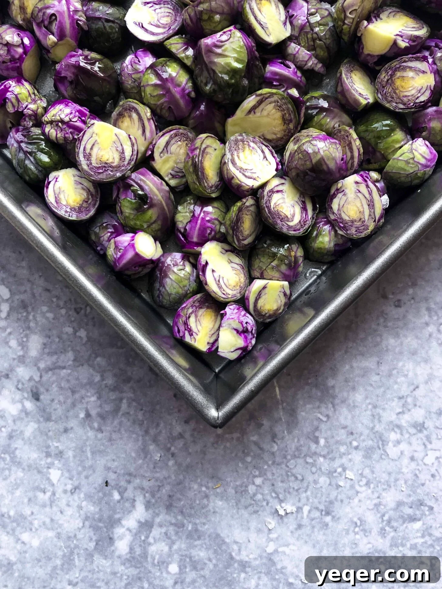 Zesty Lemon Dijon Brussels Sprouts 3 Vibrant purple lemon dijon brussels sprouts artfully arranged in a roasting pan.