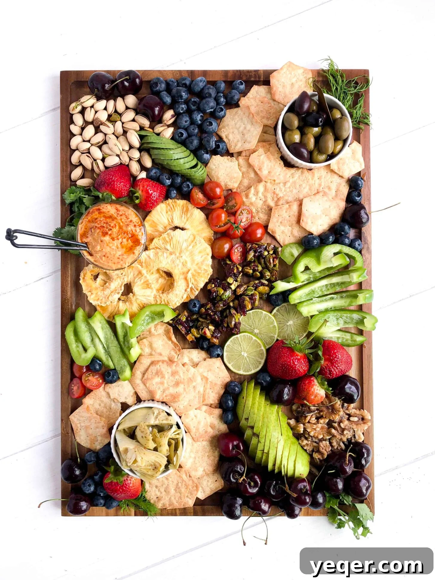 Botanical Bites Board 5 A vibrant and generously loaded Vegan Charcuterie Board, featuring an array of colorful plant-based foods, perfect for entertaining.