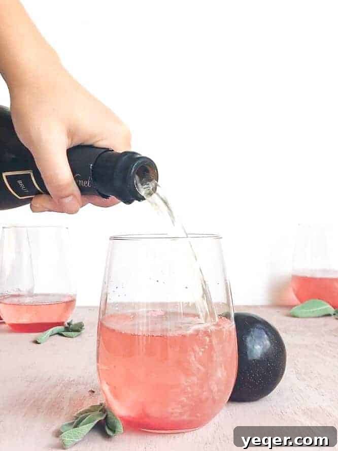 Ruby Plum Prosecco Sparkle 6 Prosecco pouring into a glass.
