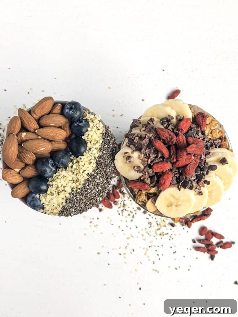 Portland Food Photography: Behind the Stellar Juices Lens 3 Two richly loaded smoothie bowls from Stellar Juices, topped with fresh fruits and granola, captured with dynamic natural light.