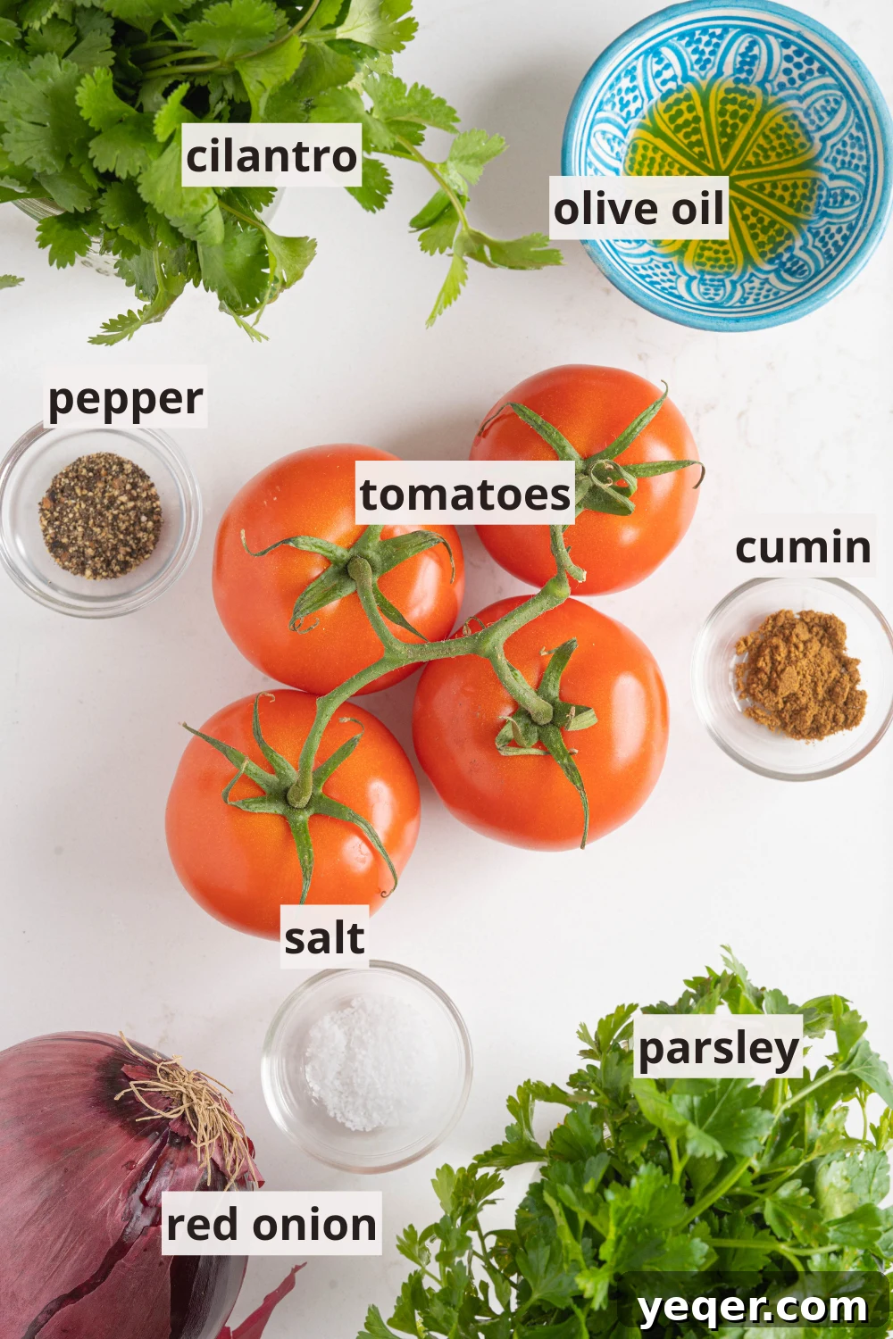 Vibrant Moroccan Tomato Salad 3 Fresh tomatoes, red onion, parsley, cilantro, olive oil, and spices laid out on a kitchen counter, ready for making Moroccan tomato salad.