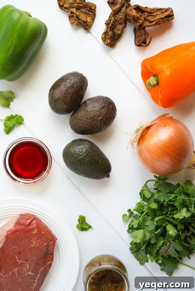 Puerto Rican Steak Avocado Boats 3 A vibrant selection of fresh ingredients for Puerto Rican Steak Stuffed Avocados.