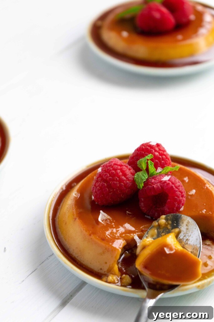 Salty Sweet Symphony: Puerto Rican Coconut Flan 12 Puerto Rican Salted Coconut Flan on small plates with raspberries.