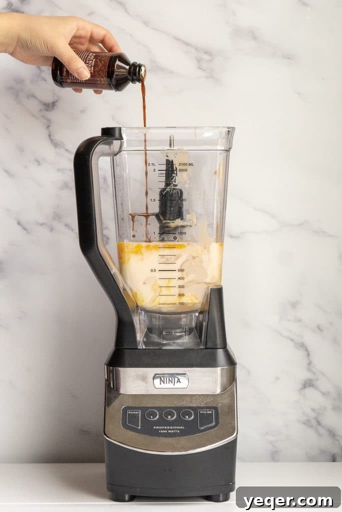Salty Sweet Symphony: Puerto Rican Coconut Flan 5 Adding ingredients to a blender for Puerto Rican Salted Coconut Flan.