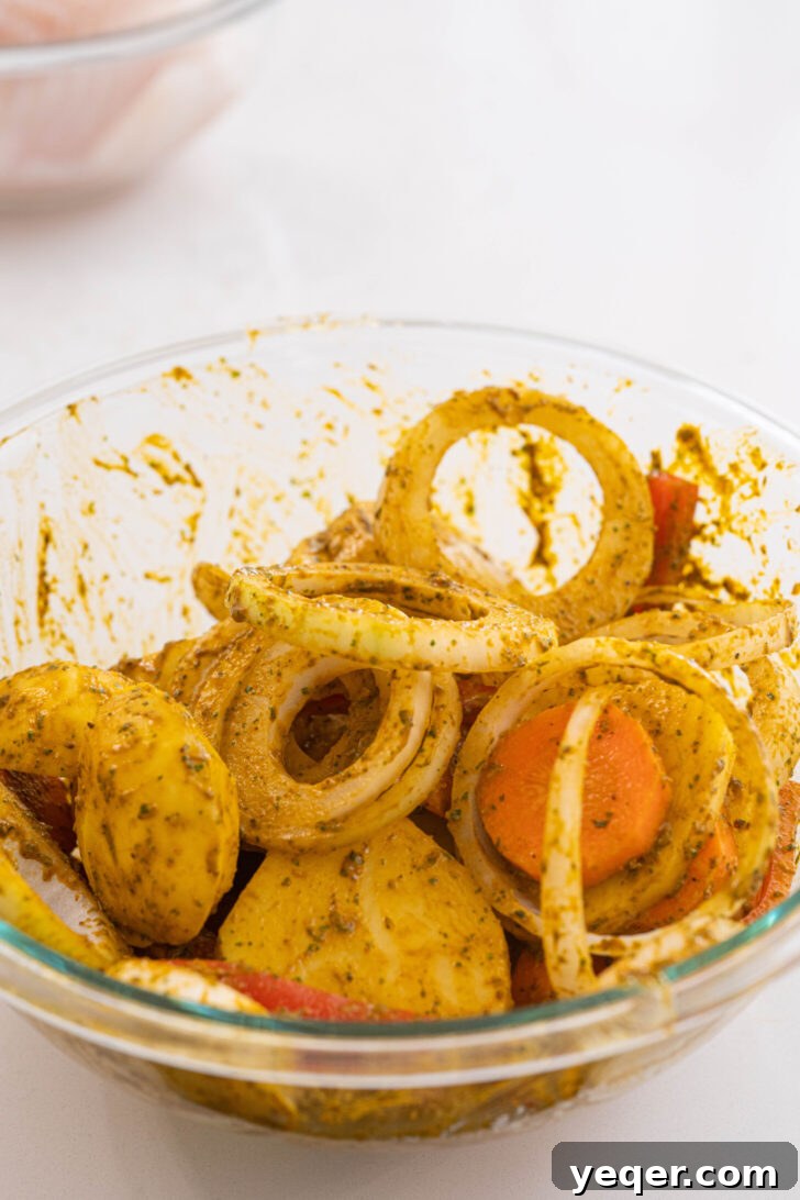 Moroccan Fish and Potato Tagine 4 A bowl of fresh vegetables coated generously with a Moroccan marinade, ready for cooking.