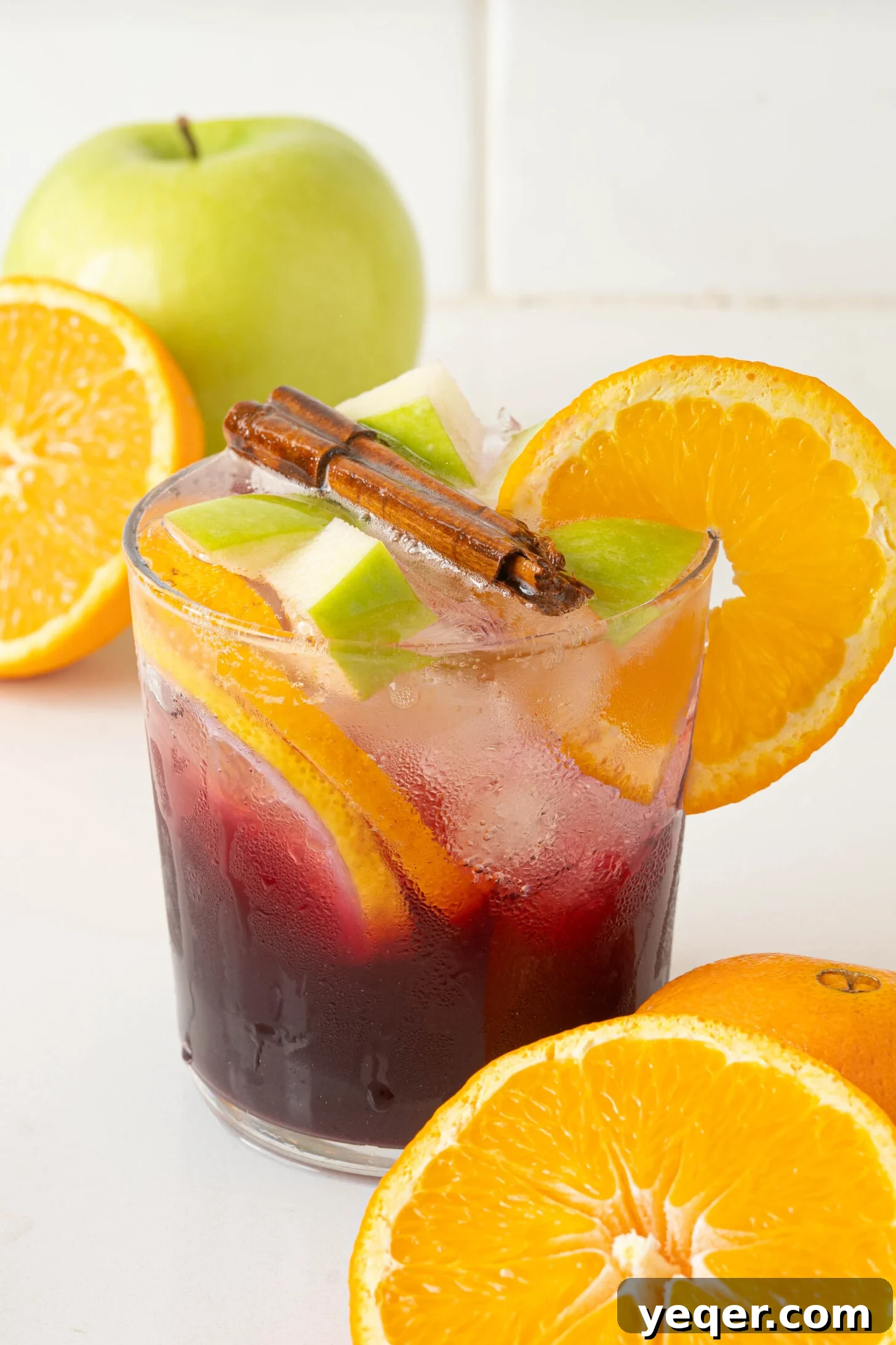 Authentic Spanish Red Sangria: Pitcher Perfect for Six 2 A vibrant glass of red sangria, garnished with fruit slices.