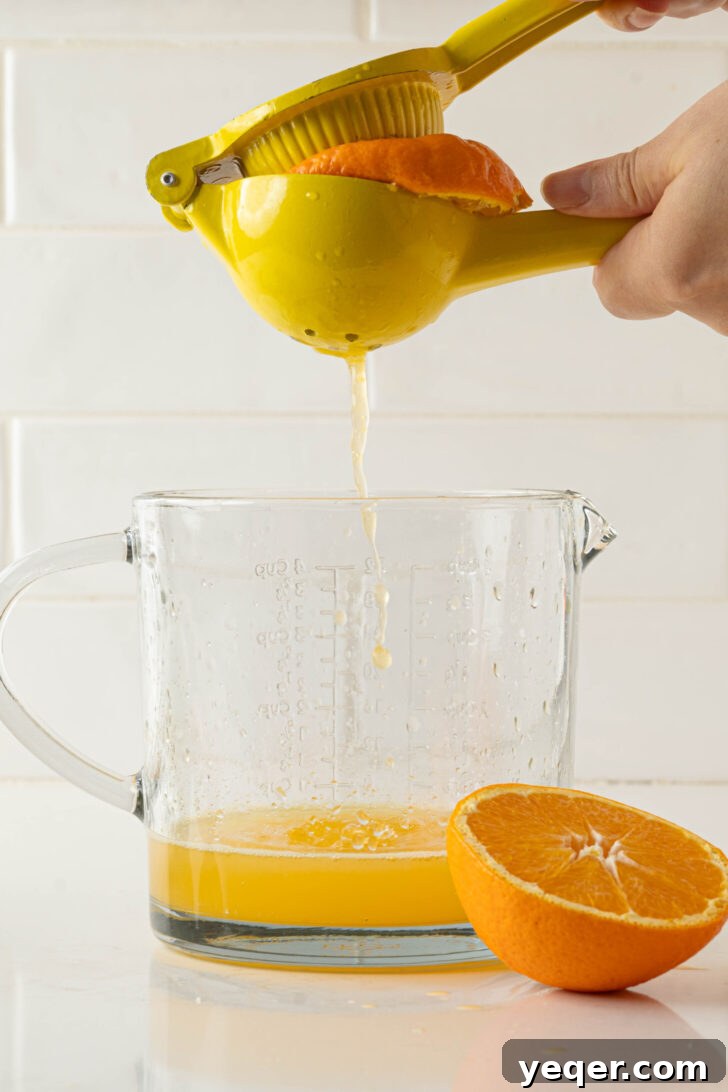 Authentic Spanish Red Sangria: Pitcher Perfect for Six 3 Squeezing oranges and lemons into a pitcher for sangria base.