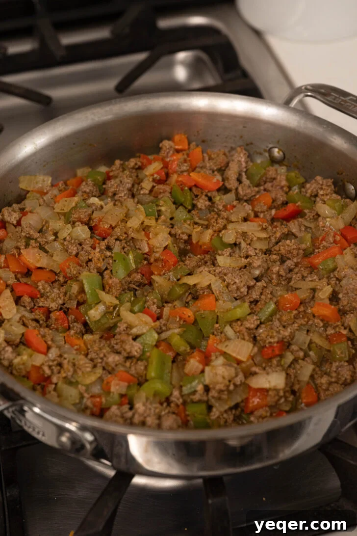 Puerto Rican Canoas Sweet Stuffed Plantain Delights 5 A pot of savory picadillo cooking on the stovetop.