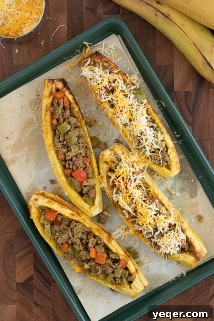 Puerto Rican Canoas Sweet Stuffed Plantain Delights 7 Stuffed Canoas de Platanos Maduros arranged on a baking sheet, ready for final baking.