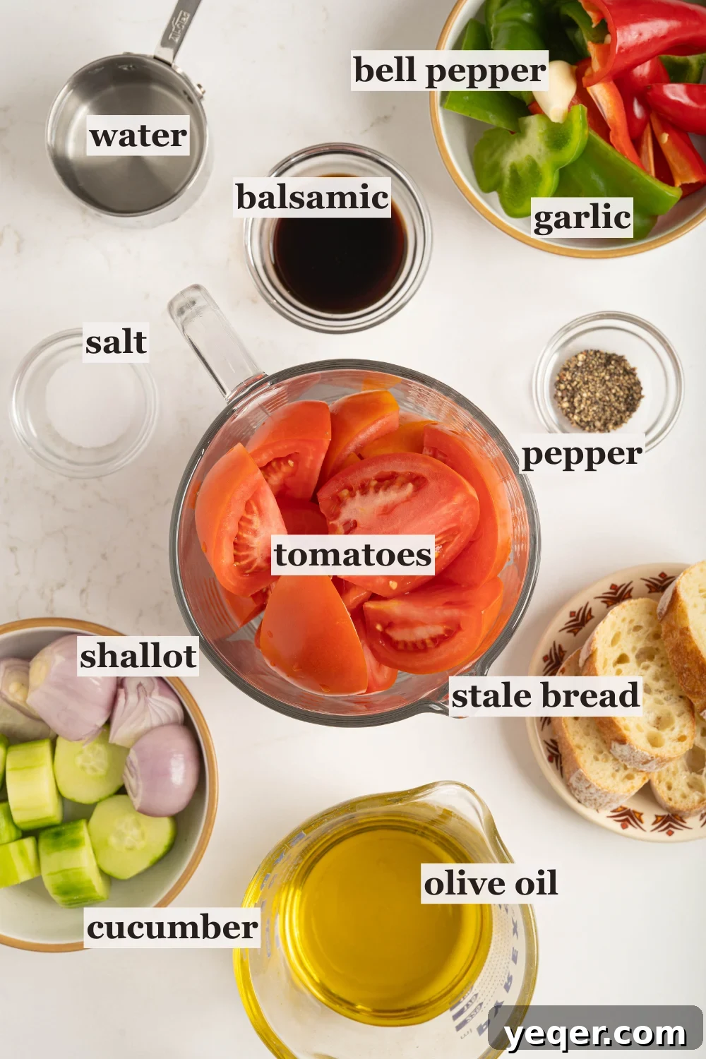 Classic Spanish Chilled Tomato Gazpacho 3 Bowls filled with fresh tomatoes, sweet peppers, olive oil, and other gazpacho ingredients ready for blending.