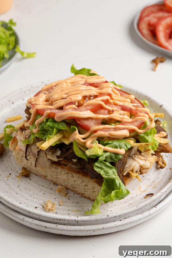Tripleta: Puerto Rican Three-Meat Sandwich Recipe and Guide 6 A tripleta sandwich on a plate.